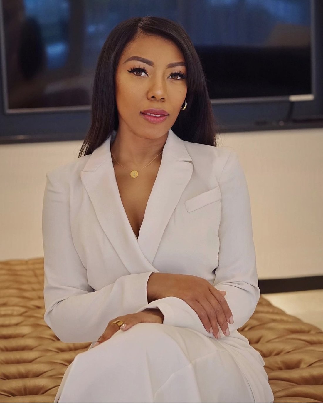 Portrait of Chilen Moya in a white blazer